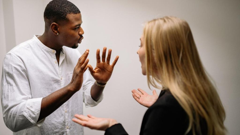 two people fighting in office