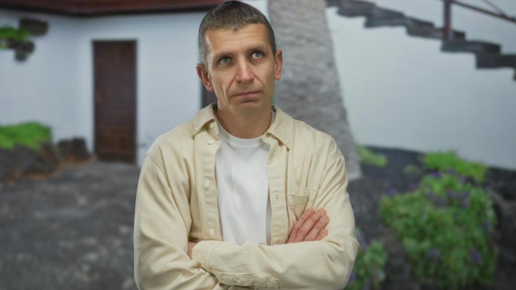man in front of a house