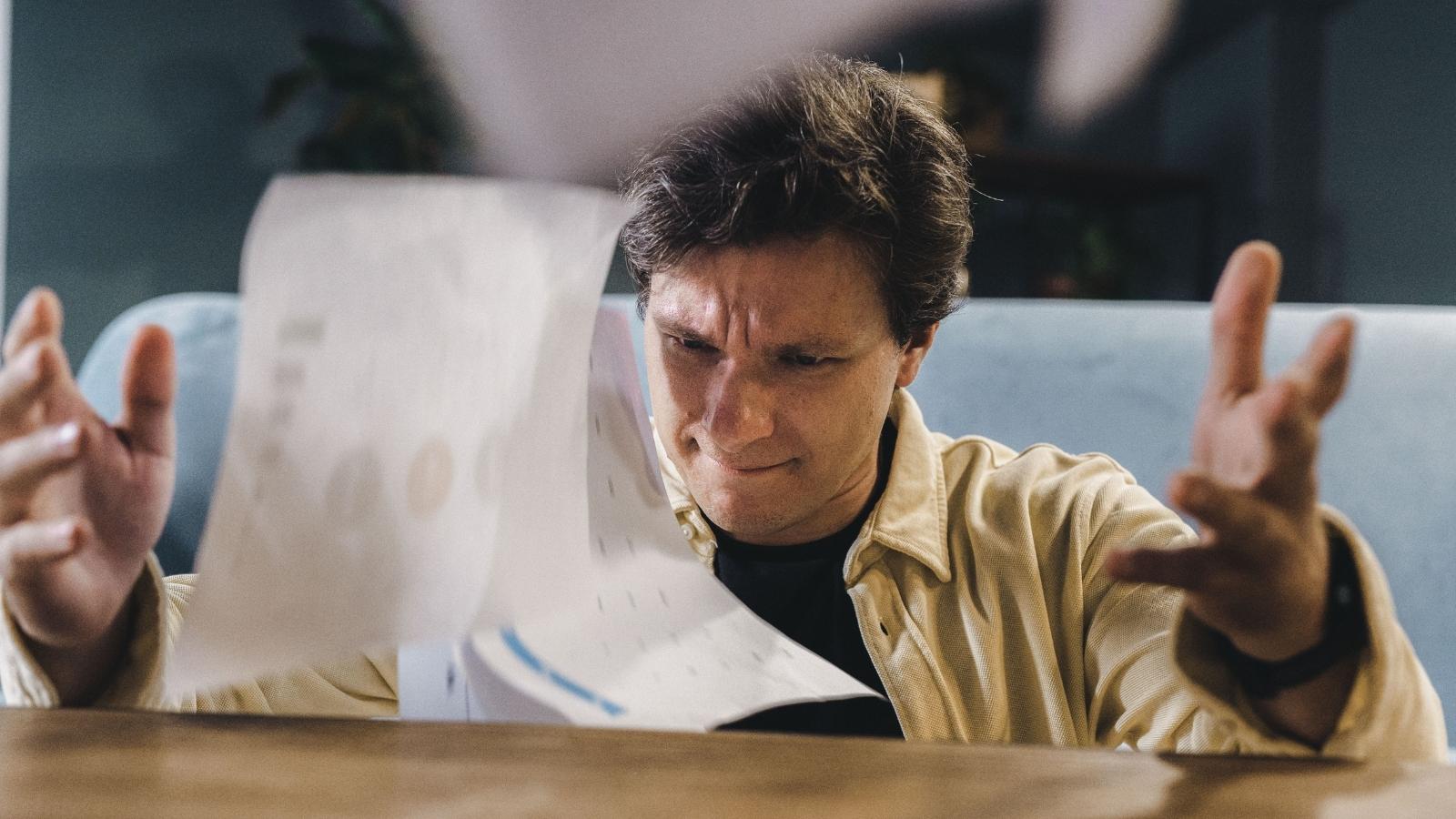 A New HOA Board Turned Their Friendly Neighborhood Into Constant Surveillance — Now Longtime Residents Are Looking for a Way Out upset man throwing a stack of papers in the air