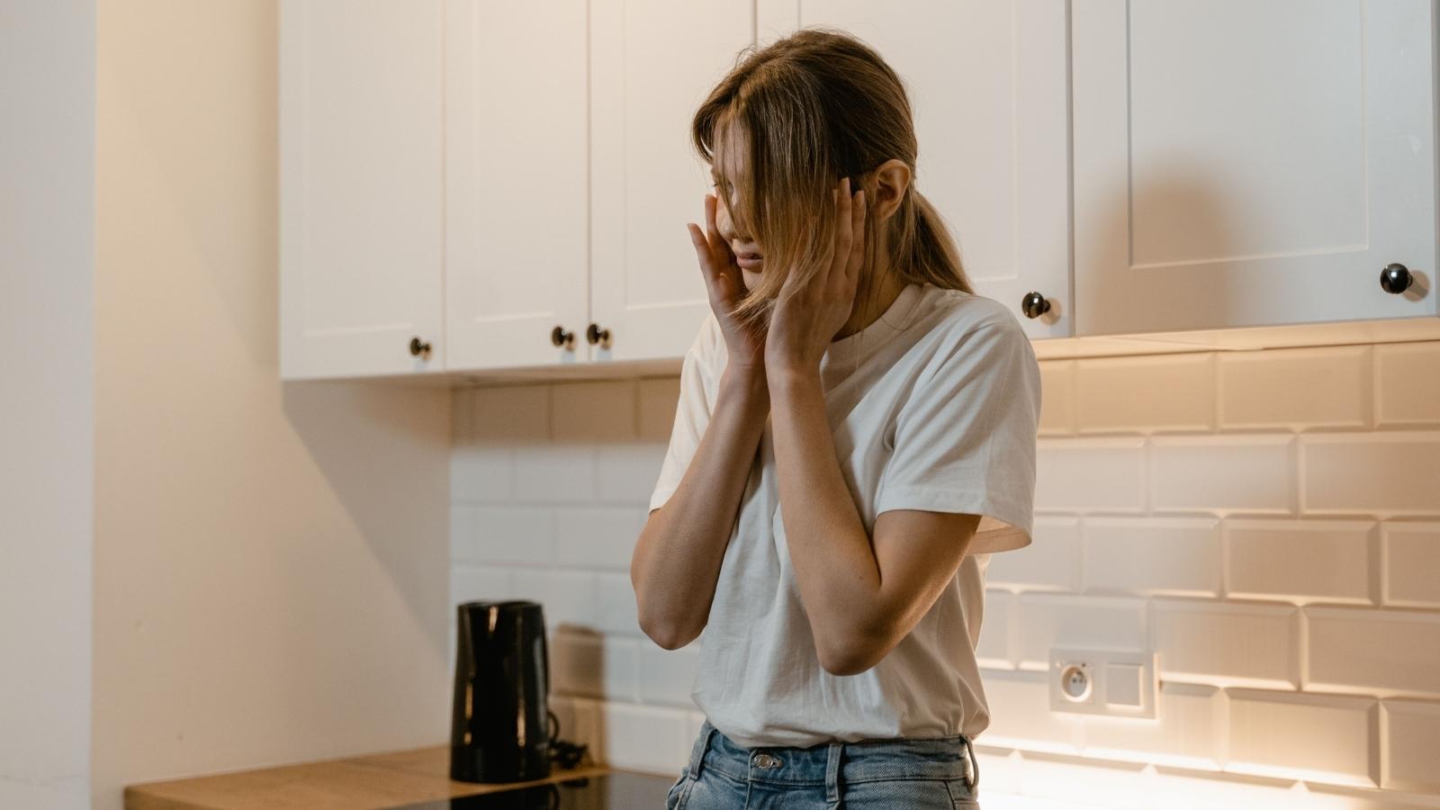 My Whole Living Room Vibrates: Renter Reaches Breaking Point Over Upstairs Neighbors Heavy Footsteps upset woman covering her ears