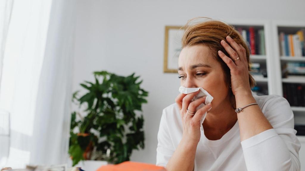 upset woman using tissue