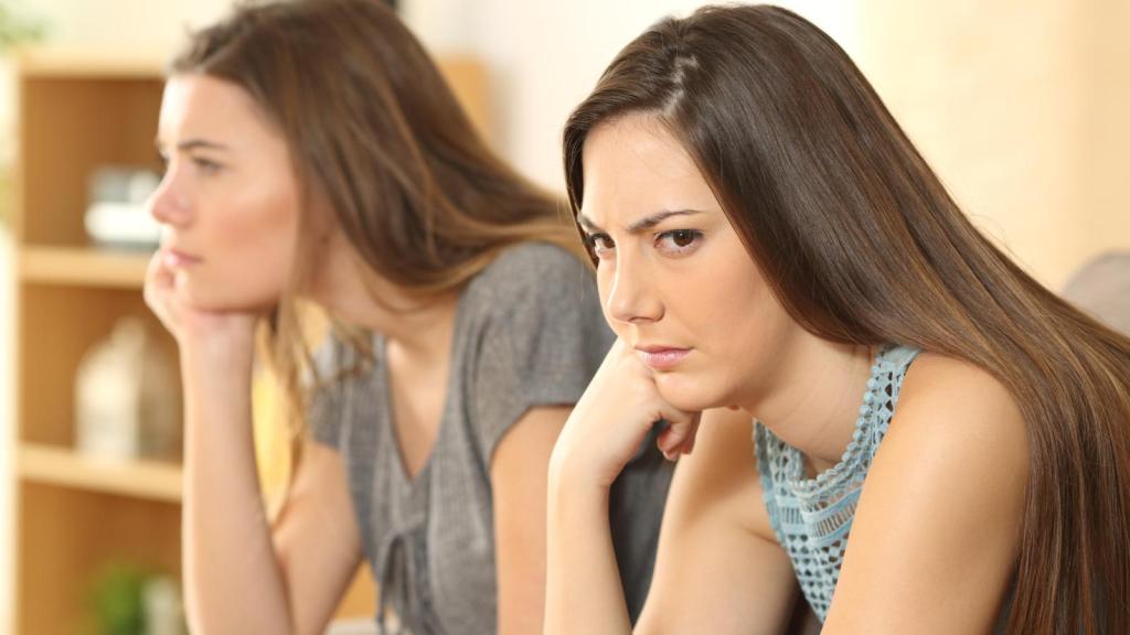 two women ignoring each other