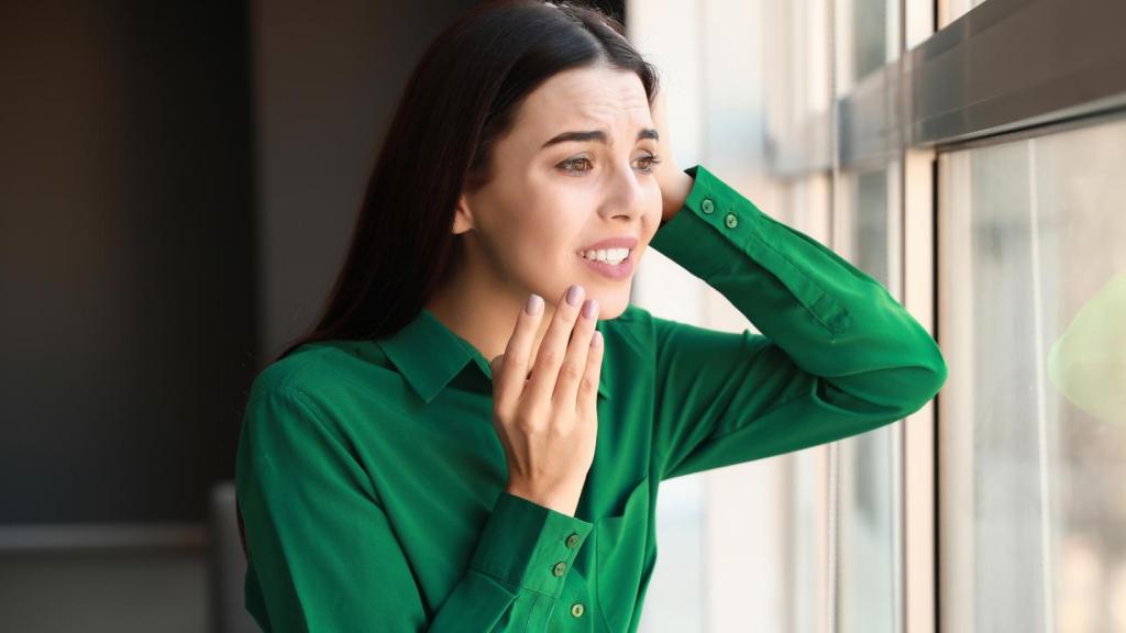 woman looking out a window