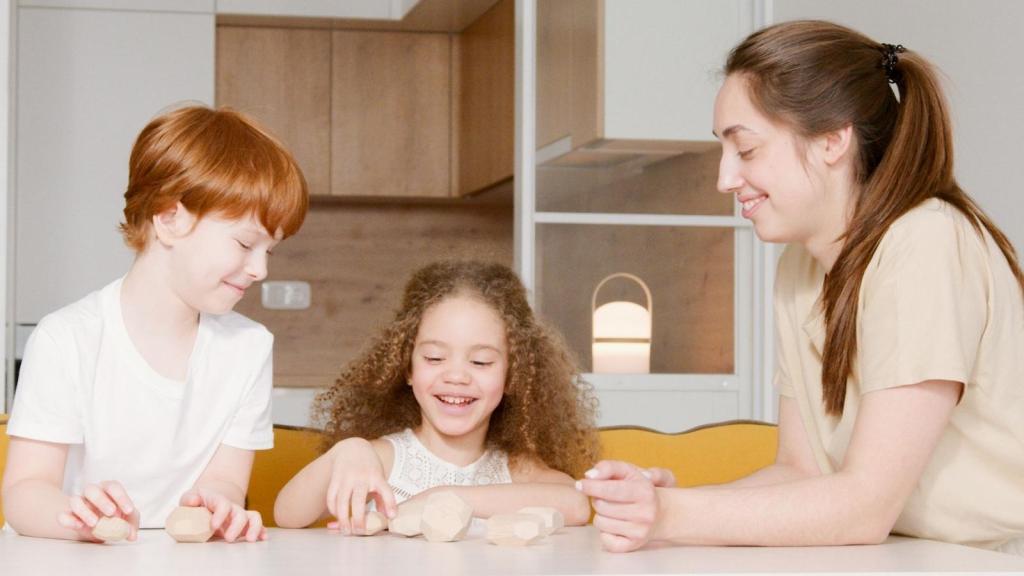 woman babysitting two kids