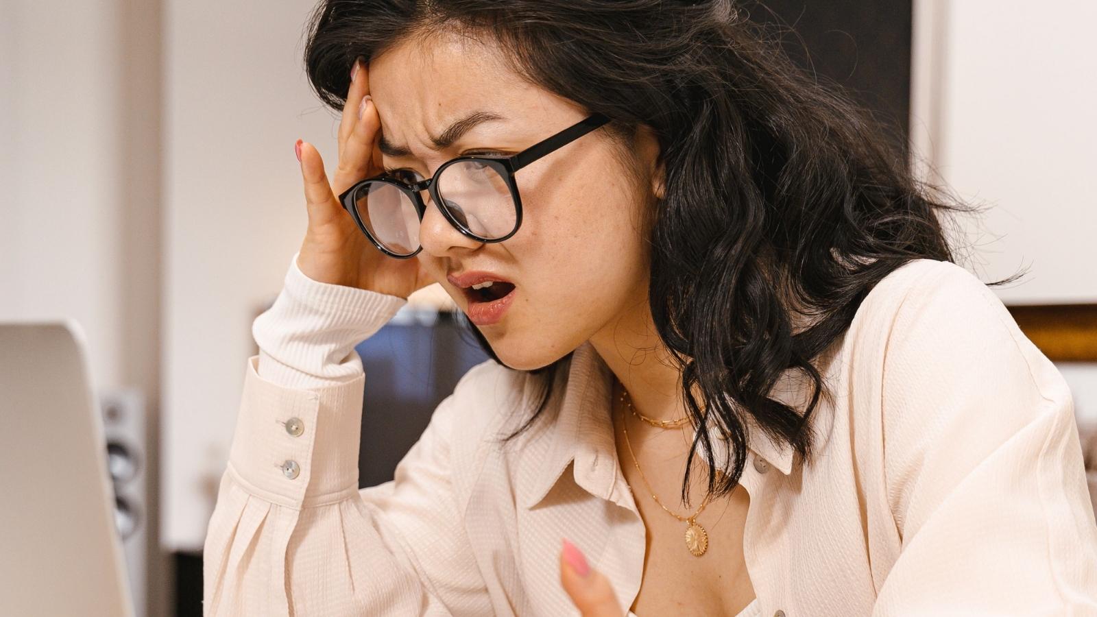 No Good Deed Goes Unpunished: Woman Shamed by Friend Group for Refusing to Cover Wedding Expenses woman in glasses looking angry