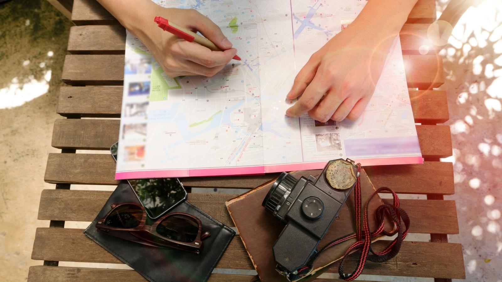 Traveler Suggested Spending A Few Hours Exploring Solo—But Her Friend Said It Was Too Dangerous woman planning her travel itinerary