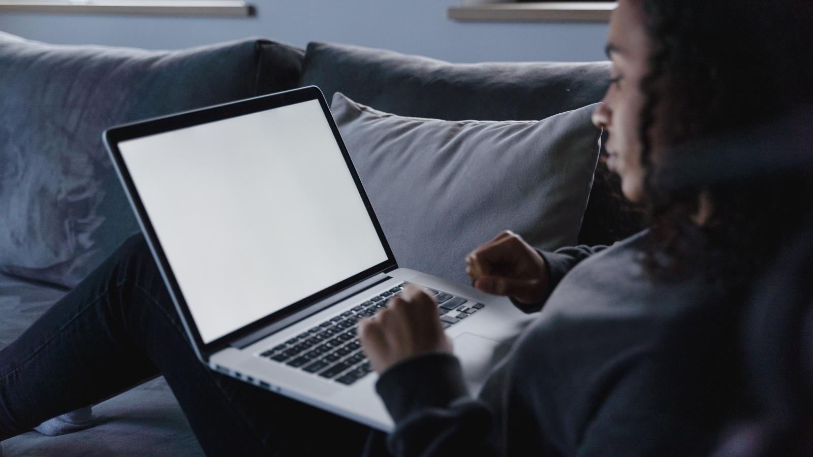 She Saved for 6 Months to Buy Her Own Laptop — Now Her Family Is Guilt Tripping Her Into Giving It Up woman typing on a laptop
