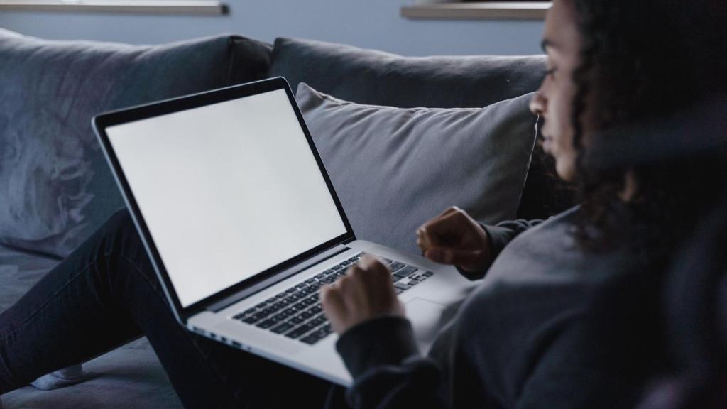 woman typing on a laptop