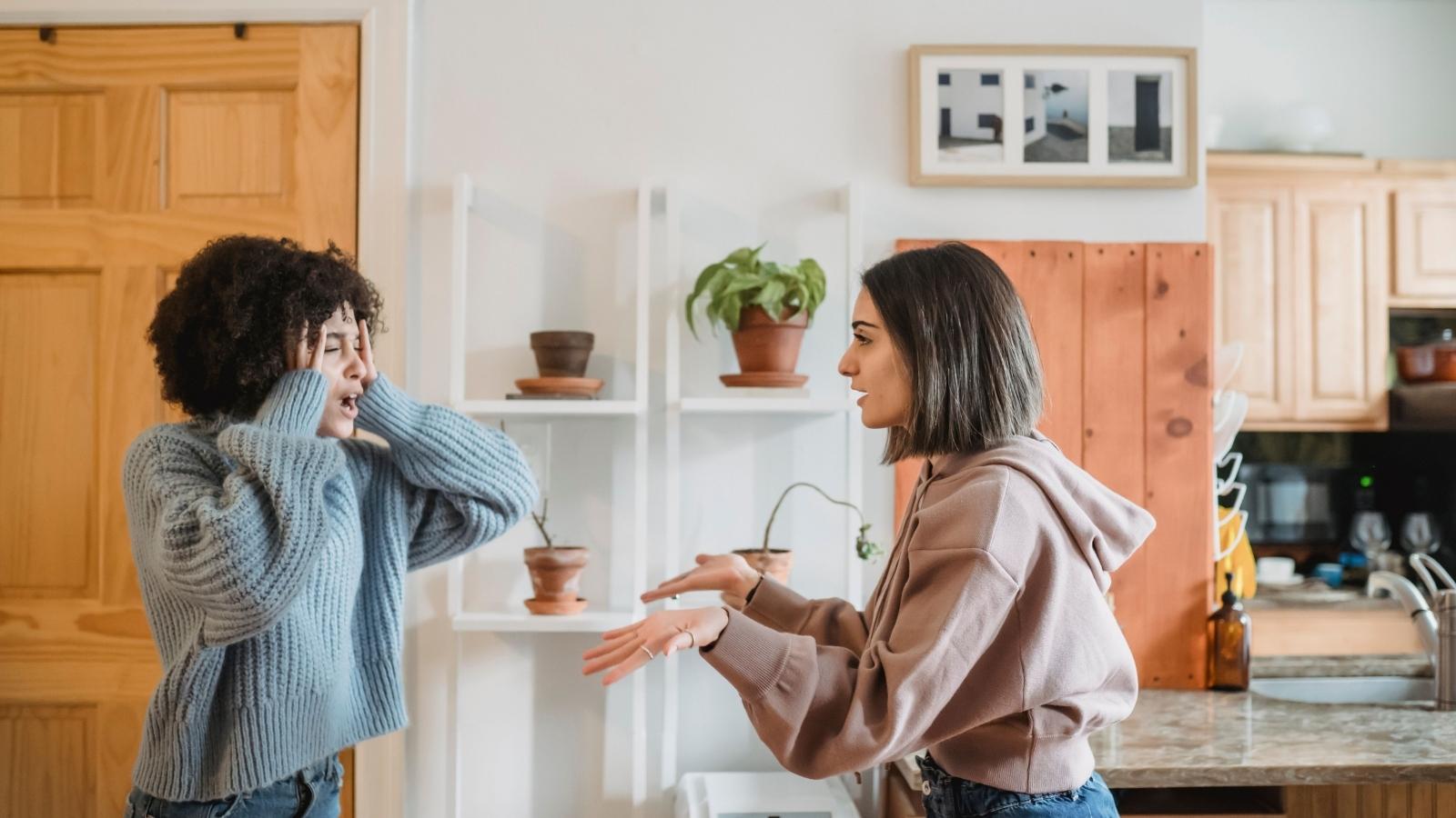 women arguing in apartment