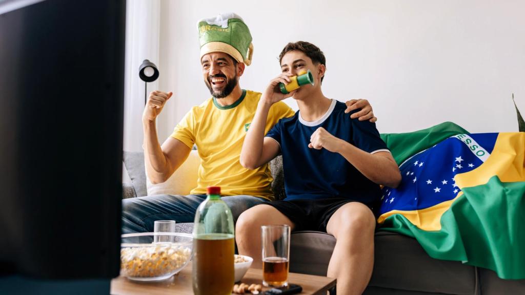 two men watching soccer