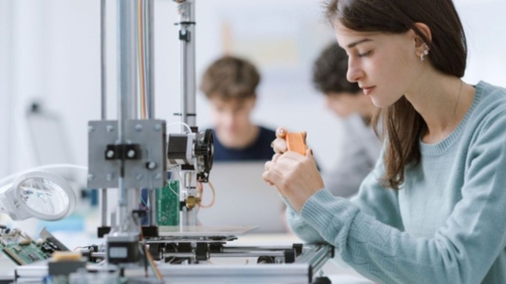 Woman using a 3D printer
