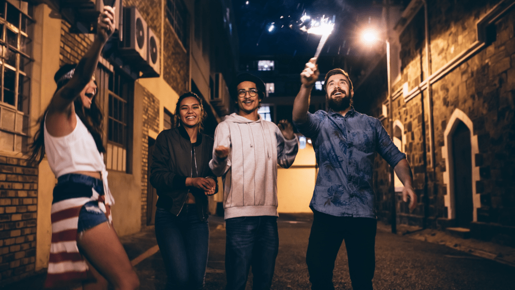4 young adults celebrating 4th of july