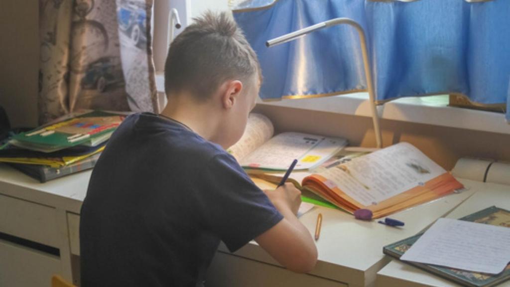 Kid focused on homework