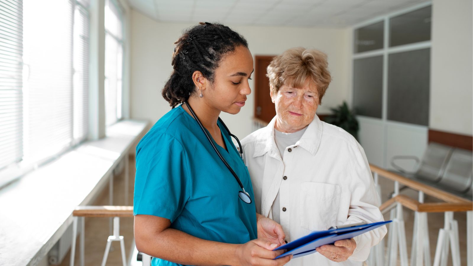A Worker Endured Months of Humiliation at Her Toxic Job—Until She Finally Had Enough and Quit Healthcare workers working together and reading a patient's file