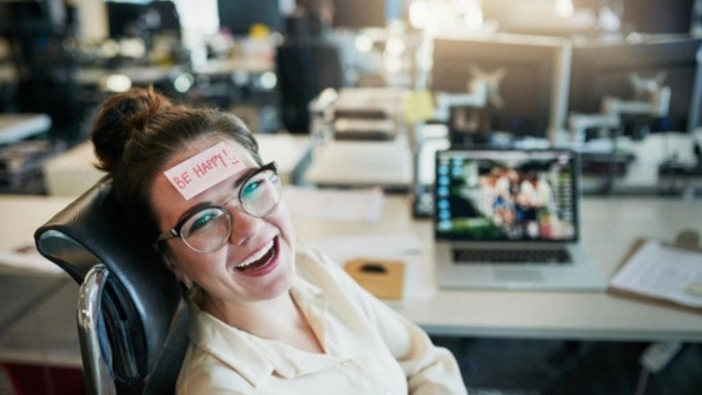 Laughing woman at work