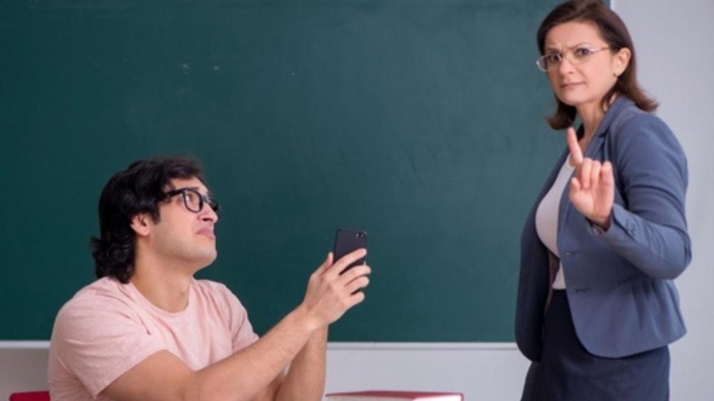 Teacher taking phone