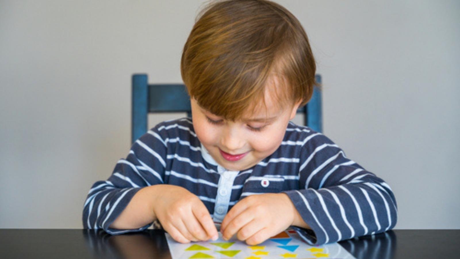 Kid using stickers