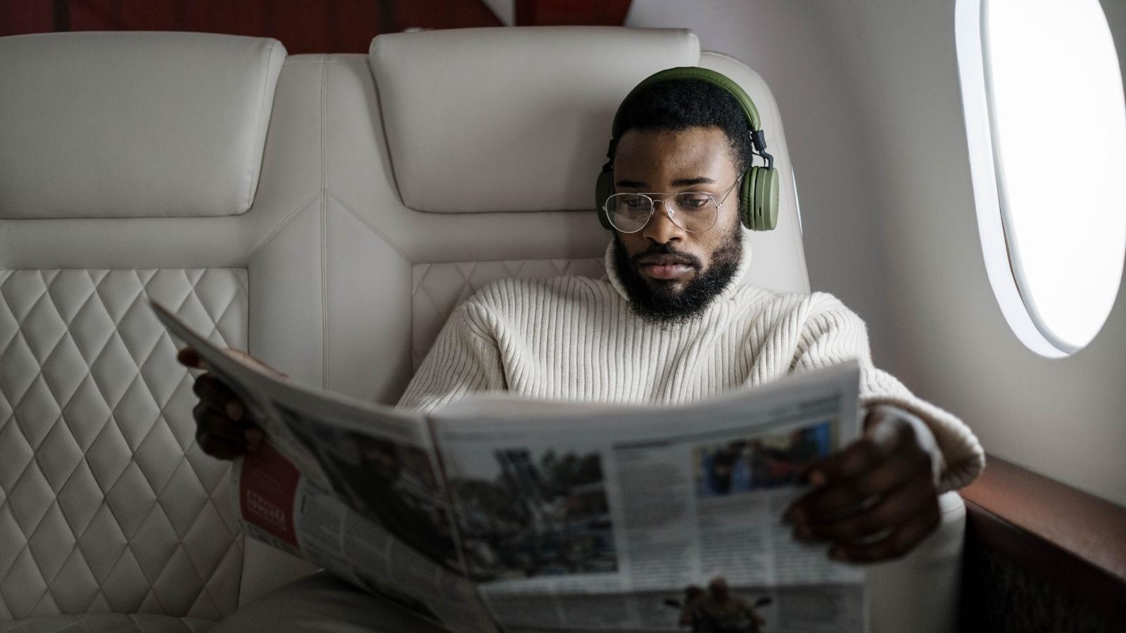A Passenger Apologized for Sitting in the Wrong Polaris Seat—but the Owner Kept Berating Him Until Crew Stepped In African American man sitting in a business class seat