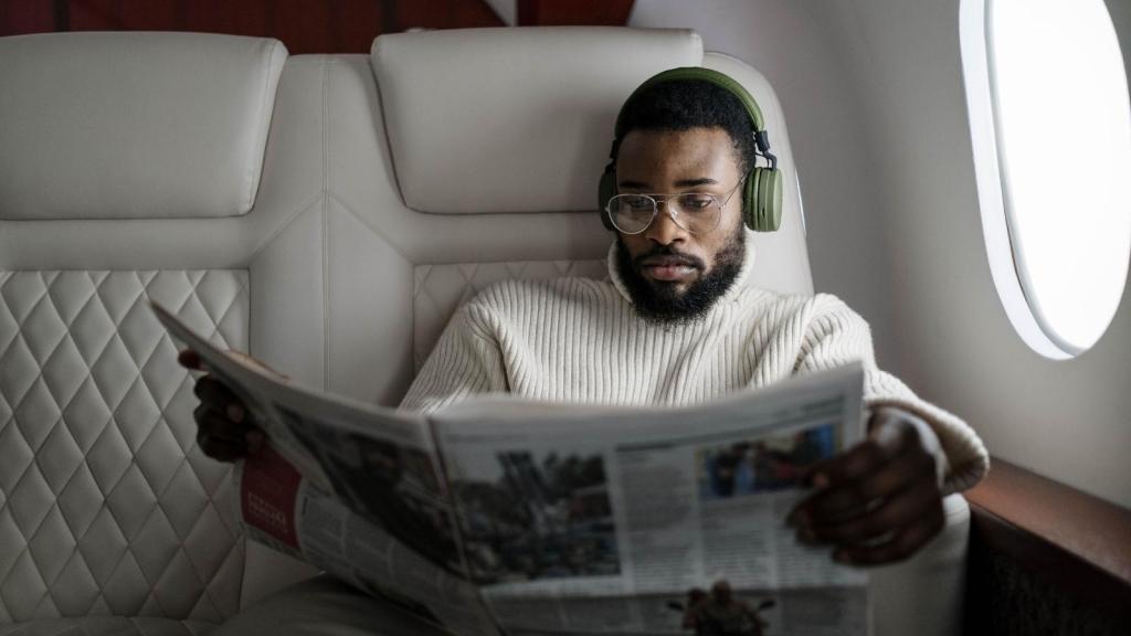 African American man sitting in a business class seat