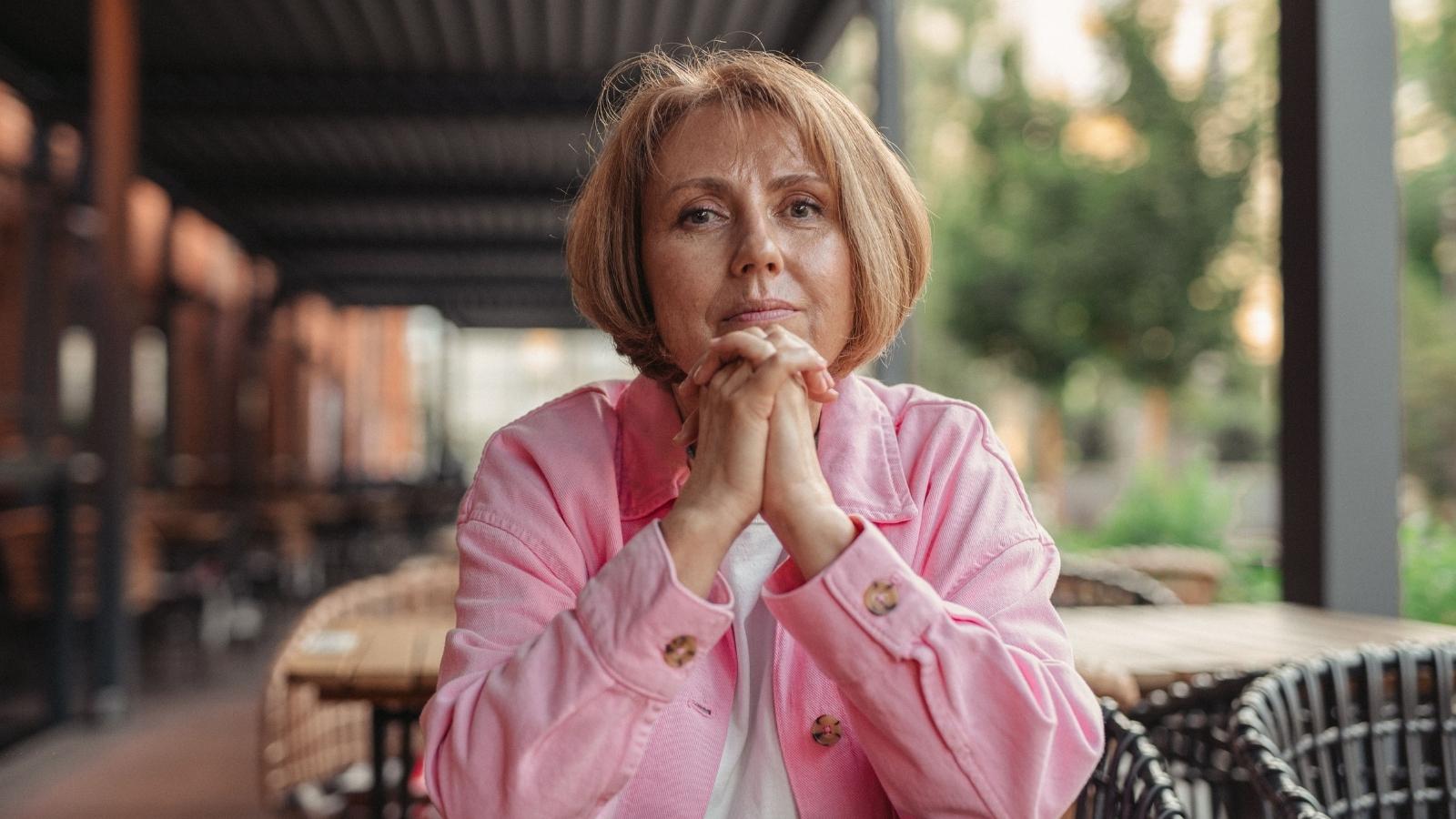 Woman sitting outside thinking about her BFF