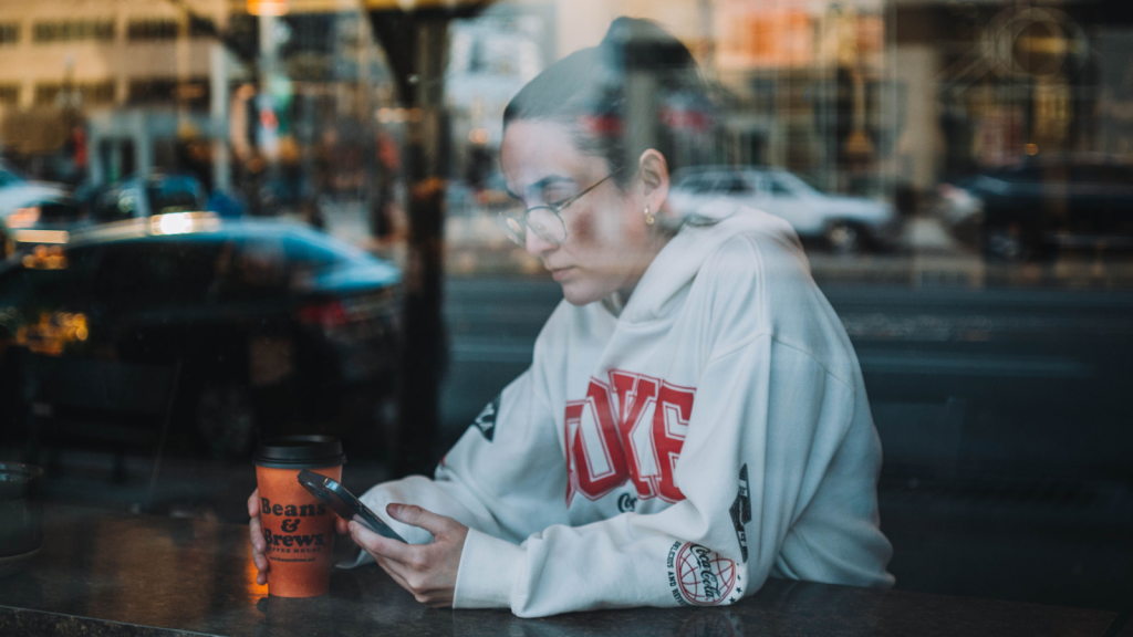 Woman sitting at a bakery thinking about a rude comment