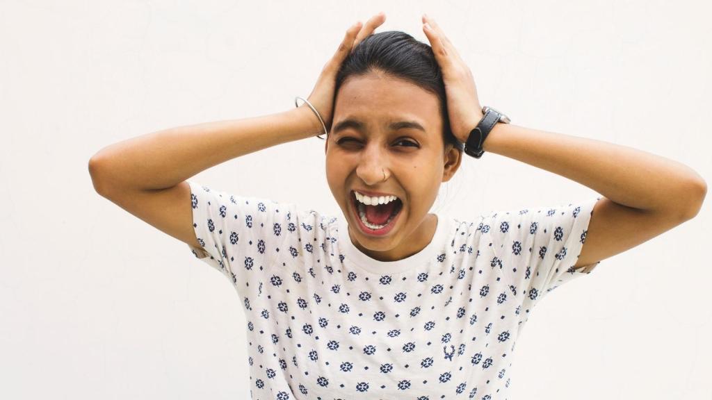 Woman holding her head after being drove crazy
