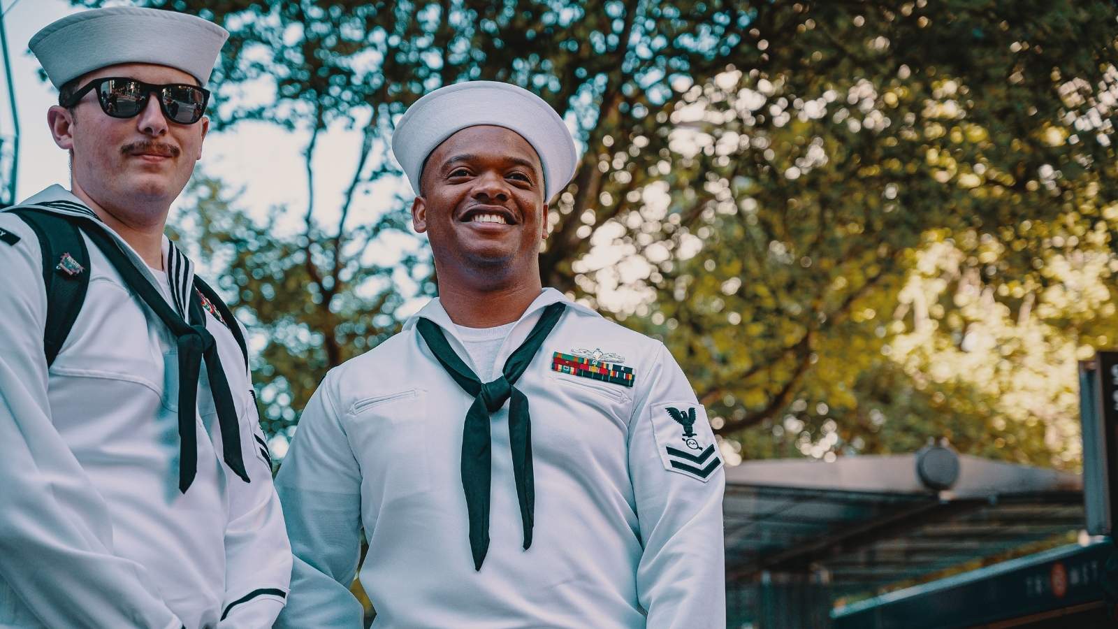 Navy Sailor Paid Extra Rent for Deployed Buddy—Then Found Out the Girlfriend Pocketed $2,500 Navy sailors smiling for a photo