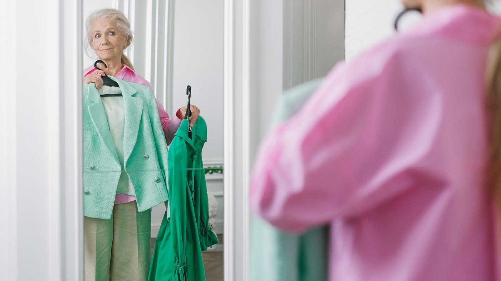 She Thought Her Dress Days Were Behind Her—Then a Retail Worker Changed Her Mind in the Fitting Room Older woman trying on clothes at a dept store