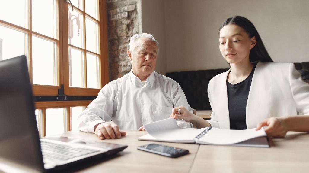 Older manager talking to a younger woman