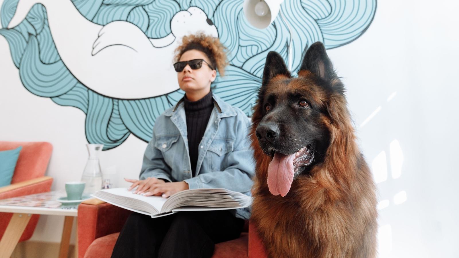 Blind woman with her service animal next to her