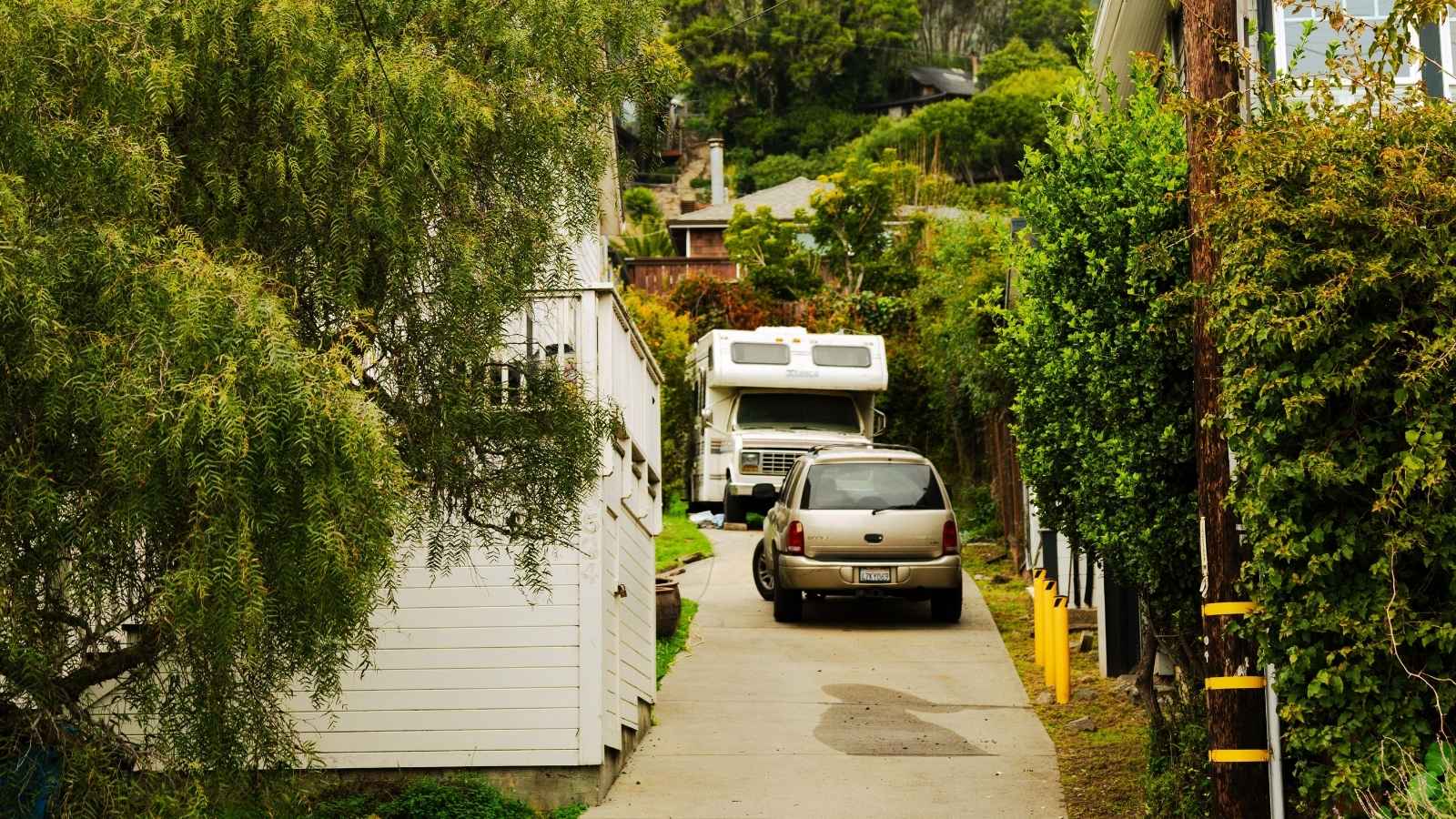 Camper parked in driveway of house