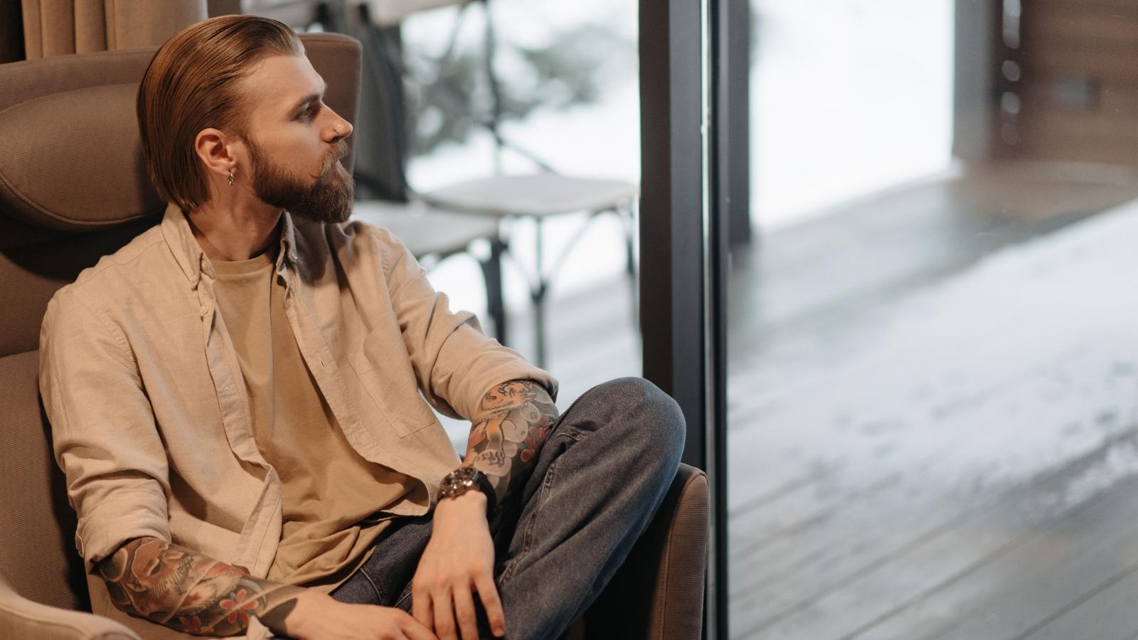 Man thinking about if he's really that loud