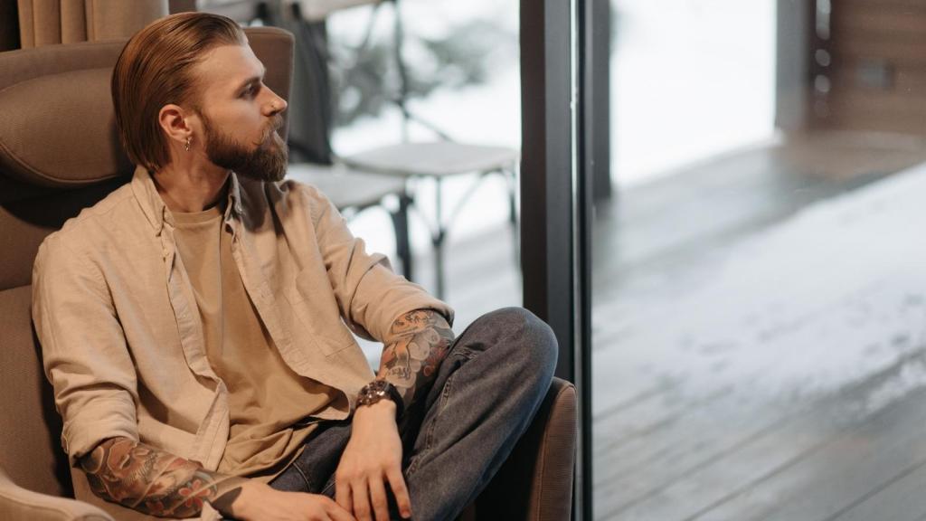 Man thinking about if he's really that loud