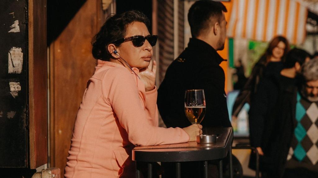 Woman sitting at a pub table by herself