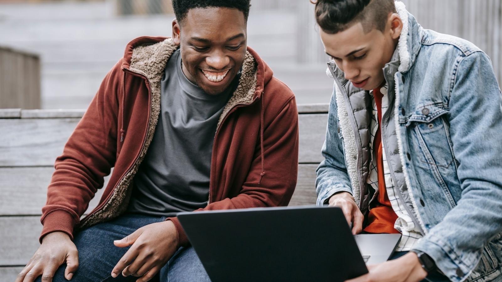 He Googled His Own Videography Business to Show His Portfolio—Then a Classmate Accused Him of Flexing Guy showing his friend a website