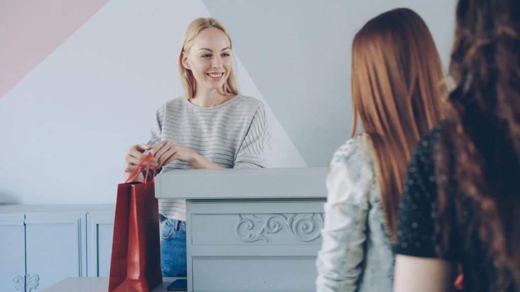 Woman cashier working at a clothing store