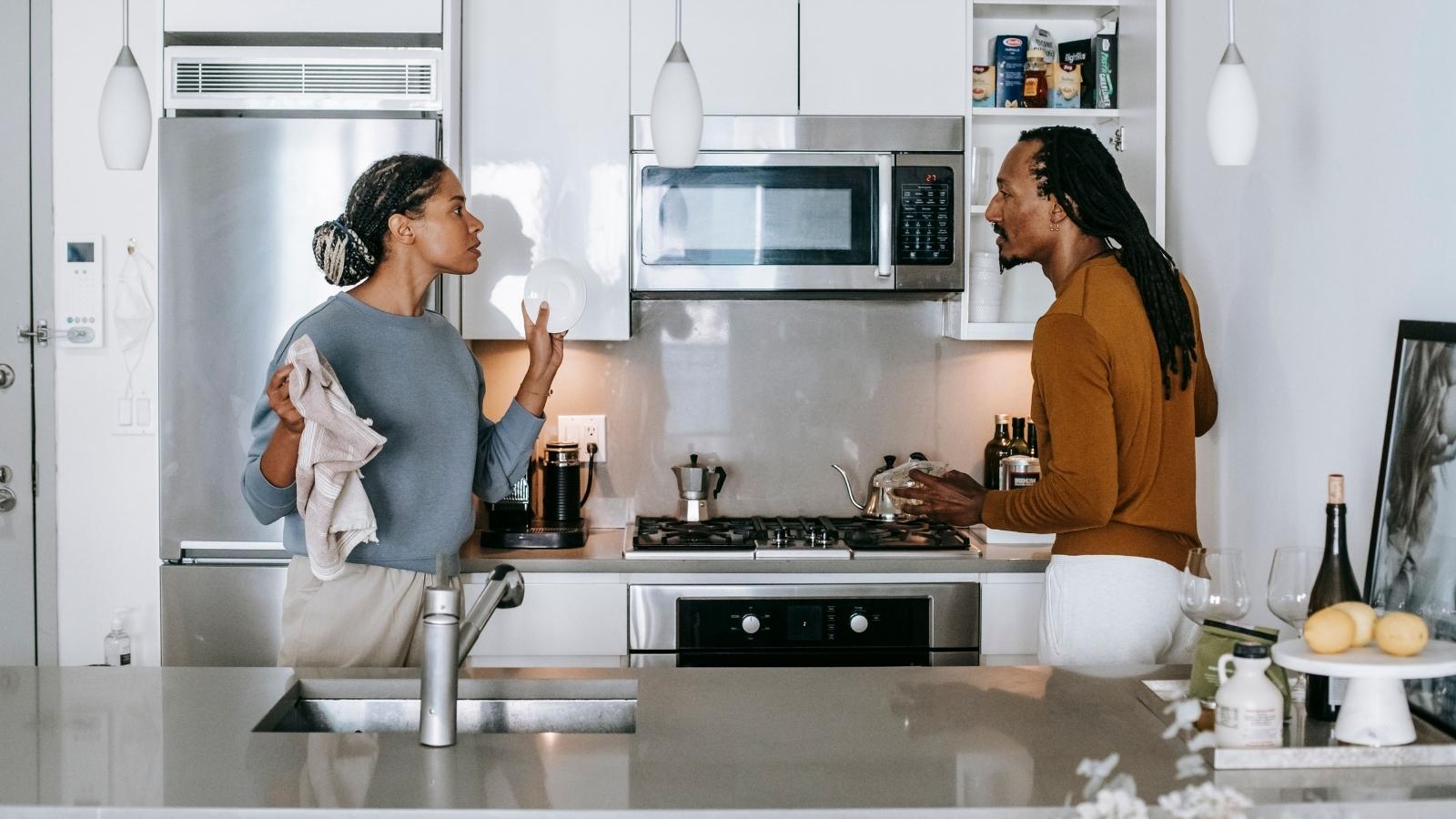 Husband and wife disagreeing in the kitchen