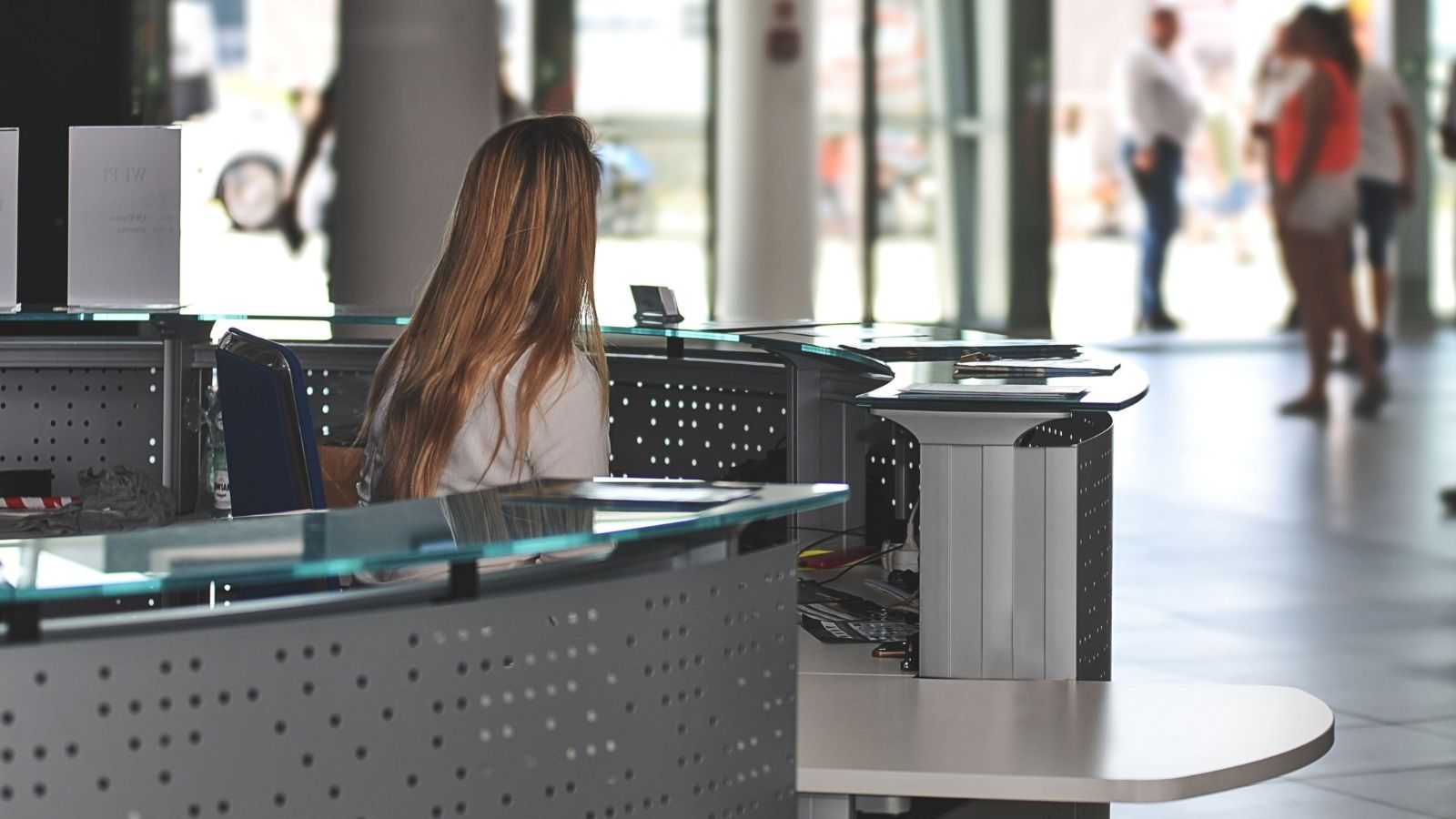 Woman sitting at a customer service desk