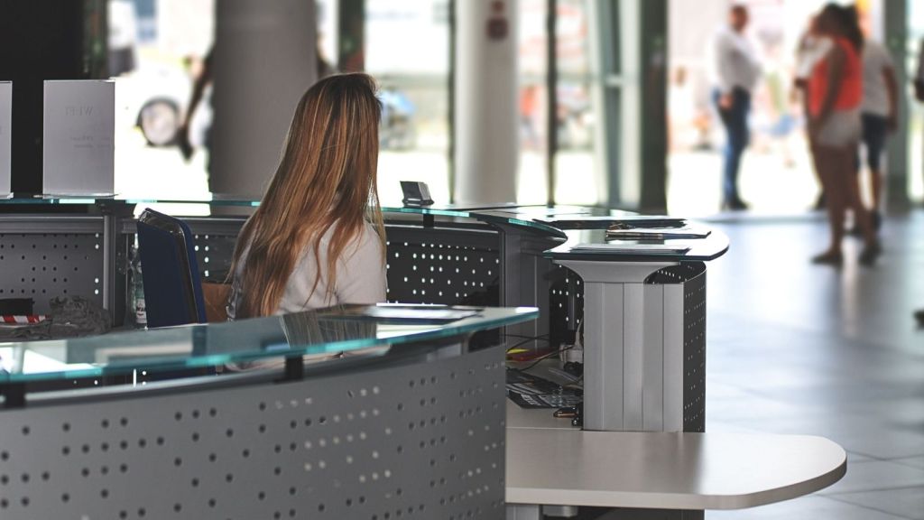 Woman sitting at a customer service desk
