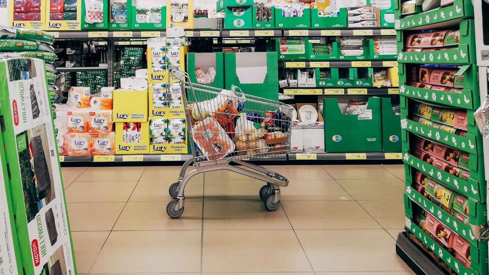 Grocery Store Employee Tells A Regular Customer To Check Out After He Keeps Shopping Past Closing, So He Argues That He Spends Too Much Money There To Be Rushed Full grocery cart parked in the aisle