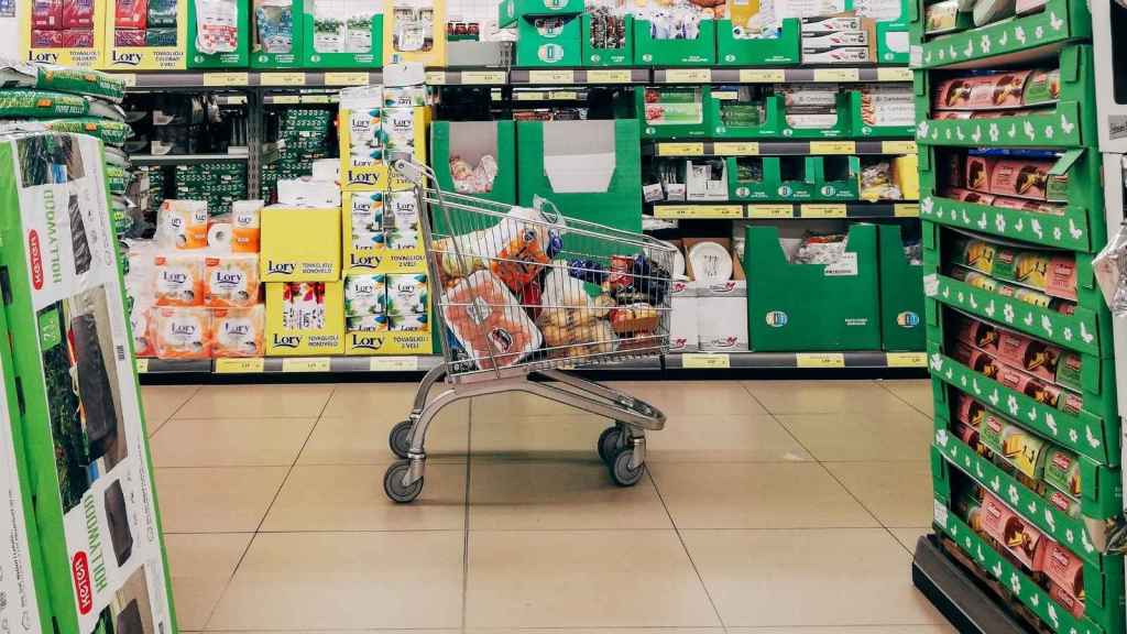 Full grocery cart parked in the aisle
