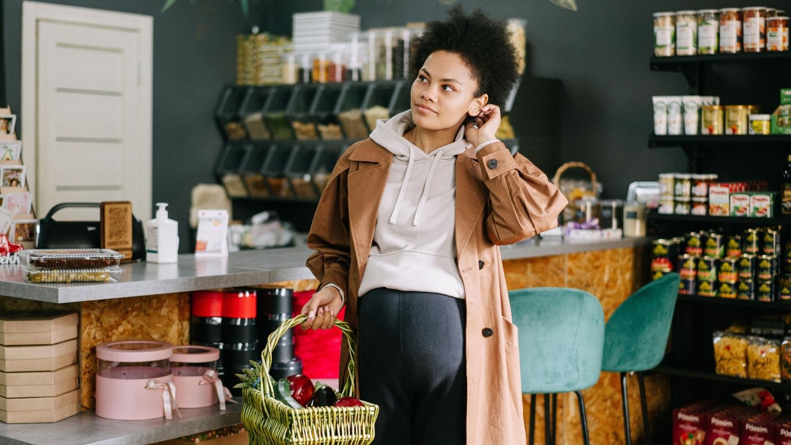 Pregnant woman shopping in the grocery store