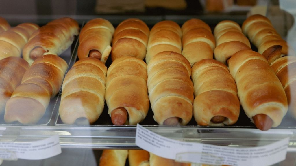Sausage rolls for sale at a bakery