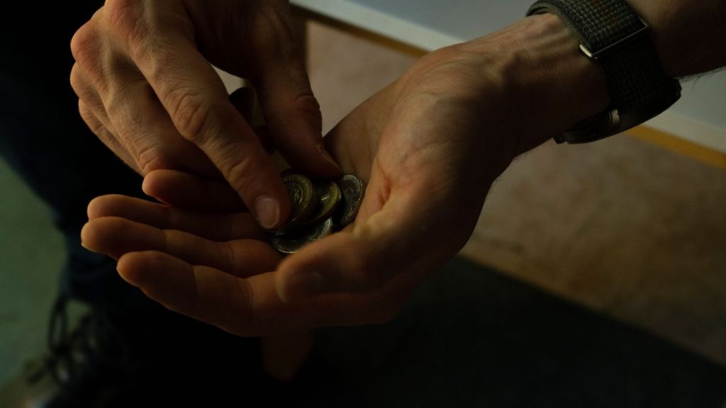 Man counting change in his hand