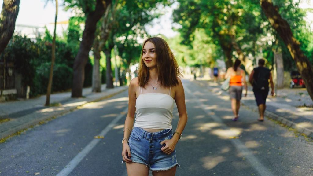 Pretty woman walking through her neighborhood