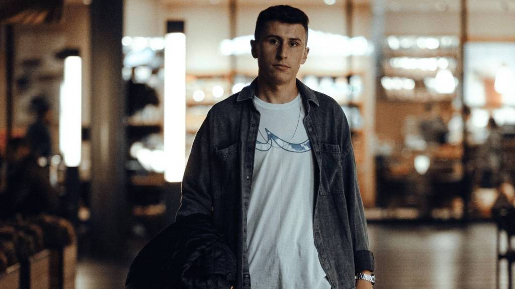 Young man walking out of his department store job