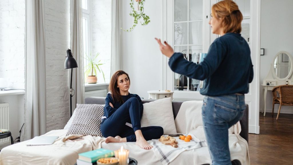 Woman listening to her mother tell her what to do
