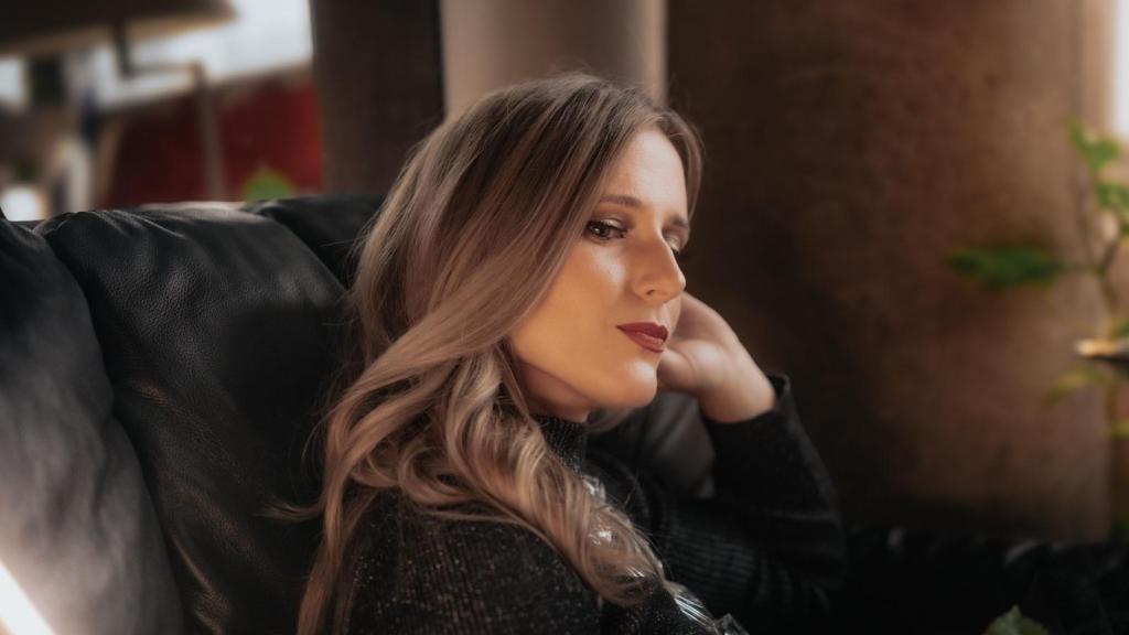 Woman thinking about how she's being sued by her boss