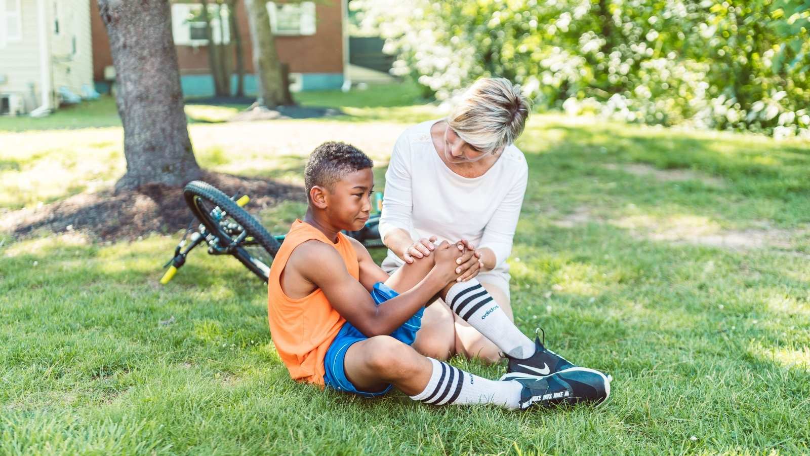 Woman helping an injured child outside