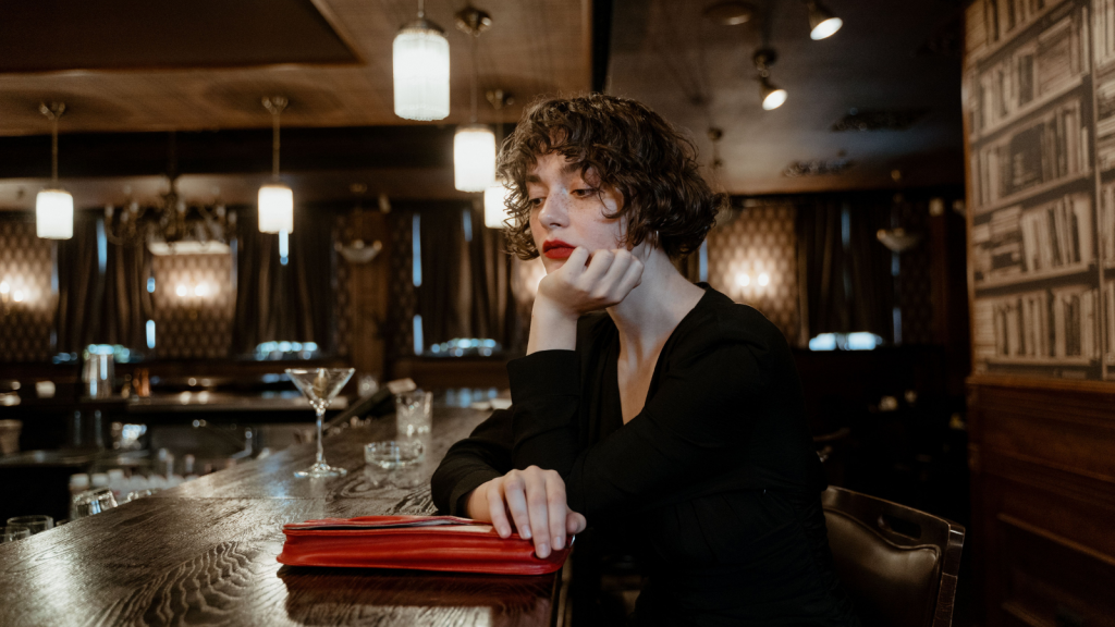 Server sitting at the bar thinking about an incident